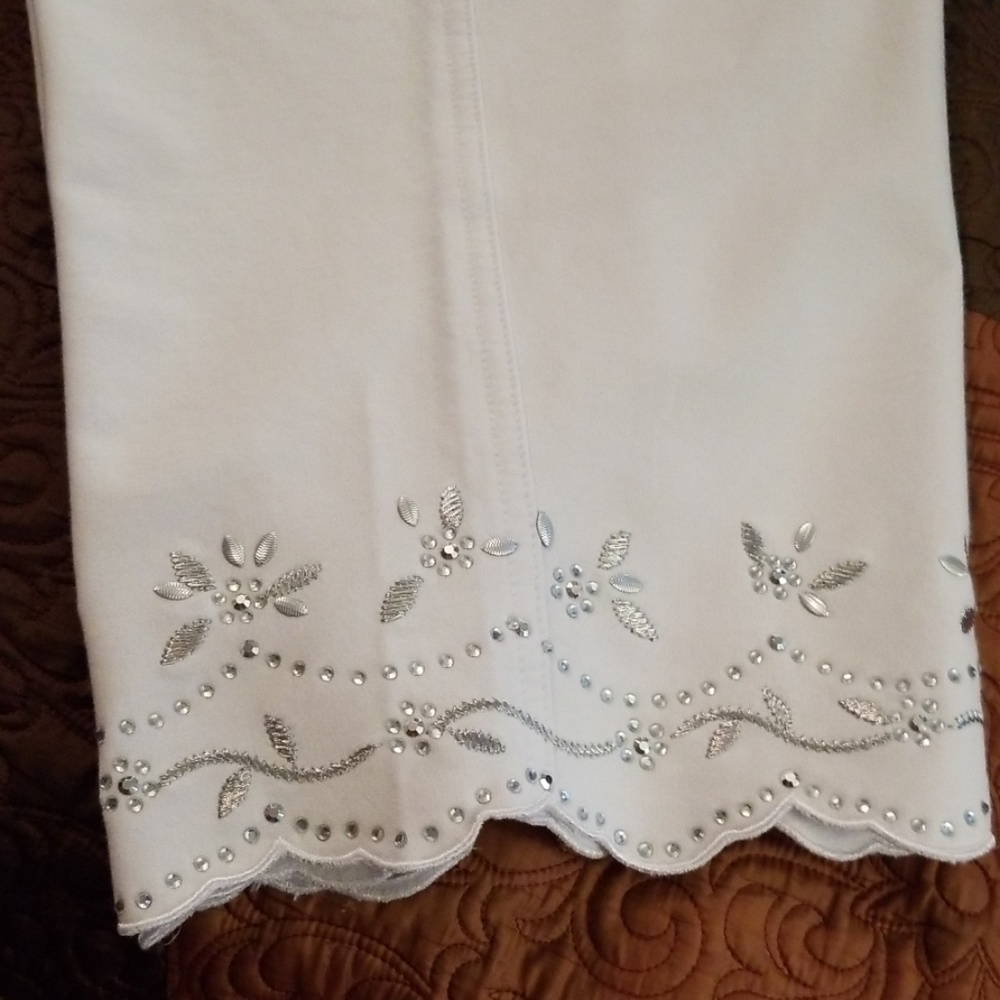 White capris with rhinestone embelishments